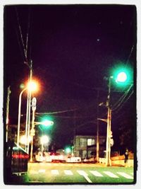 Illuminated street light at night