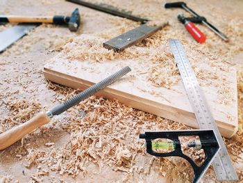 High angle view of tools on wood. woodworking, carpenter tools, wood shavings.