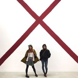 Full length of boy playing with arms raised