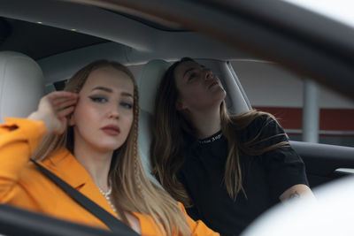 Portrait of woman sitting in car