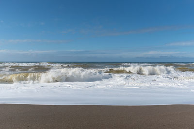 Scenic view of beach against sky