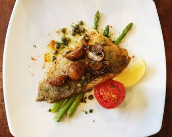 Close-up of fish steak served in plate