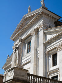 Low angle view of historical building against blue sky