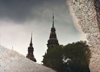 Reflection of cathedral in puddle
