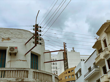 Electric lines with angle view on building 