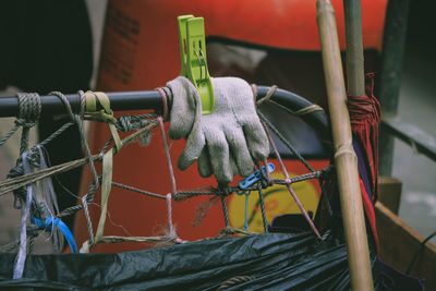 Close-up of gloves on metal