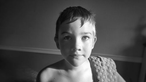 Portrait of shirtless boy at home