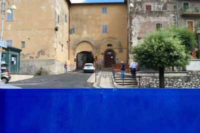 Narrow street amidst buildings in city