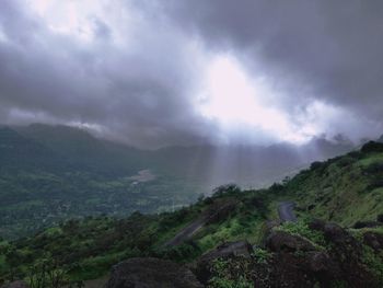 Scenic view of mountains against sky during rainy season