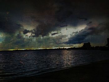 Scenic view of sea against dramatic sky