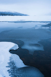 Ice formations on frozen lake in winter