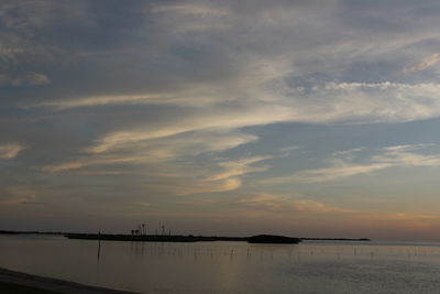 Scenic view of calm sea at sunset
