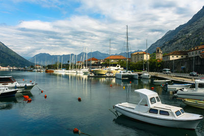 Boats moored at harbor