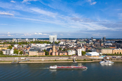 High angle view of river amidst buildings in city