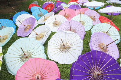 High angle view of parasols on grassy field