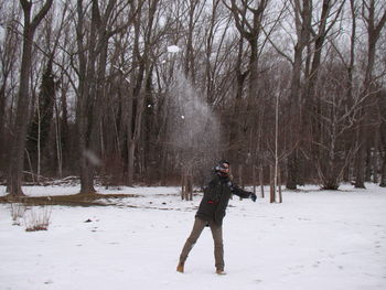 Man standing on snow covered field