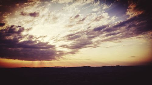 Scenic view of silhouette landscape against sky during sunset