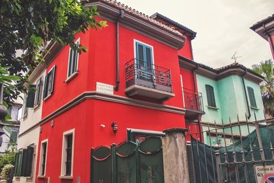 Low angle view of red building against sky