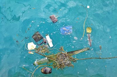 High angle view of garbage floating on sea