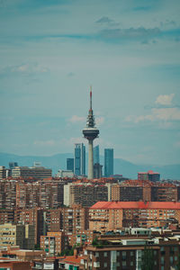 Buildings in city against sky