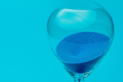 Close-up of drink against blue background