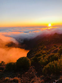 Scenic view of landscape against sky during sunset