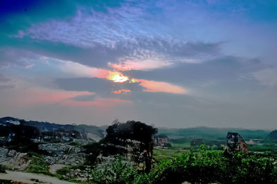 Scenic view of landscape against sky at sunset