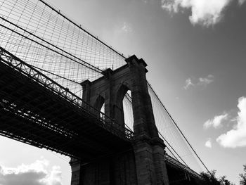 Low angle view of brooklyn bridge against sky