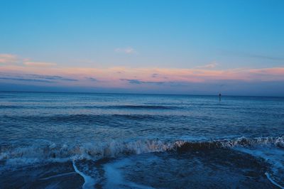 Scenic view of sea at sunset