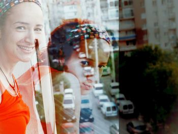 Double exposure woman and buildings