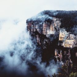 Scenic view of mountain during foggy weather