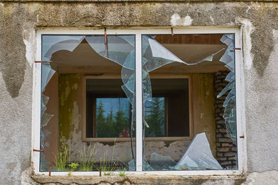 Broken windows of an abandoned hotel