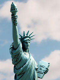 Low angle view of statue against cloudy sky