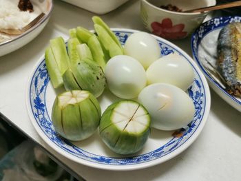 High angle view of fruits in plate on table