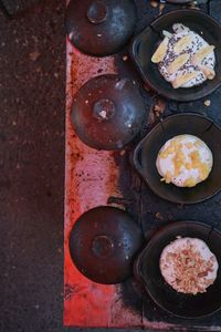 High angle view of bread on rusty metal