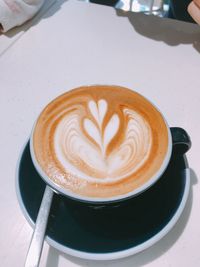 High angle view of cappuccino on table