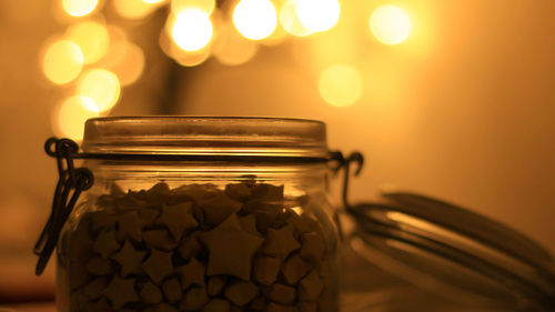Close-up of food in jar in illuminated room