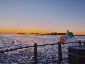 Scenic view of sea against clear sky during sunset