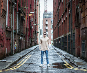 Young man standing on street