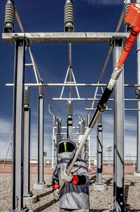 Electric technician in wind farm transmission area