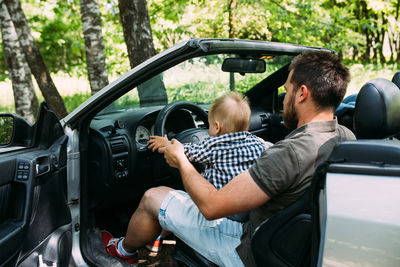 Rear view of people in car