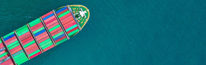 High angle view of multi colored boat in sea