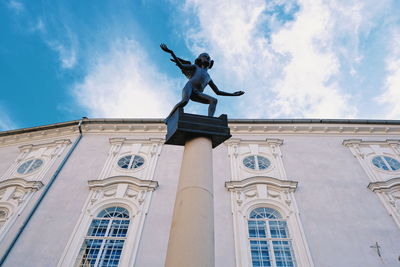 Low angle view of statue against sky