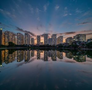 Reflection of buildings in city at night