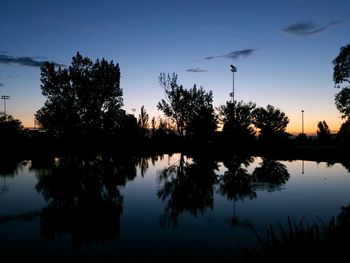 Scenic view of calm lake at sunset