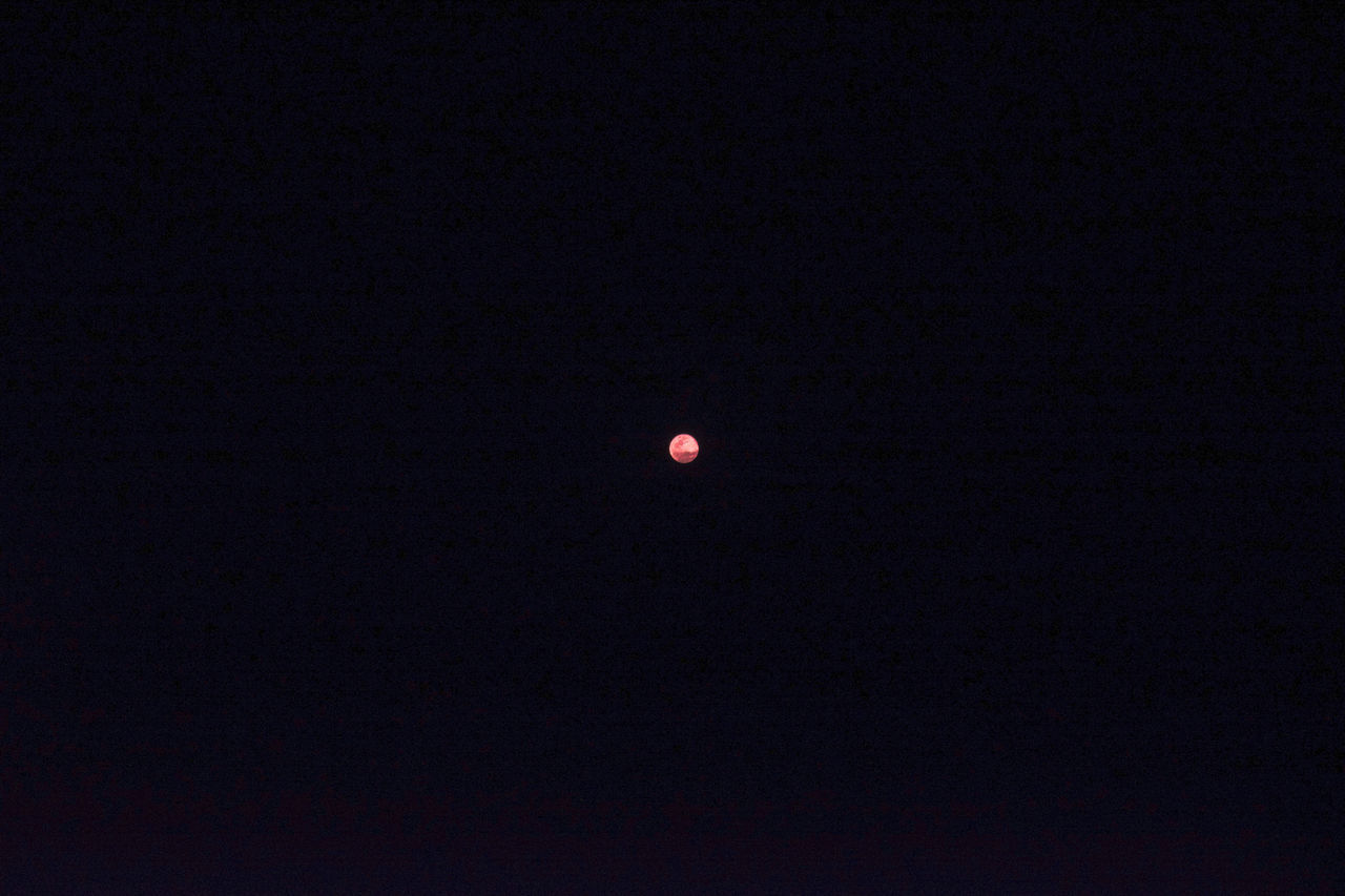 LOW ANGLE VIEW OF MOON AT NIGHT