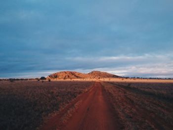 Road amidst landscape against sky