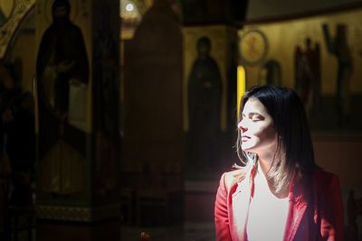 Young woman praying in church