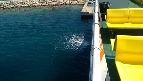 High angle view of yellow boat in sea