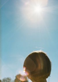 Portrait of woman against sky on sunny day